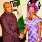 Governor Udom Emmanuel in a handshake with Christiana Esio Udoh