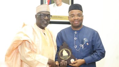 Mr Udom Emmanuel (middle), former Peoples Democratic Party, PDP, Chairman Alhaji Ahmed Markarafi